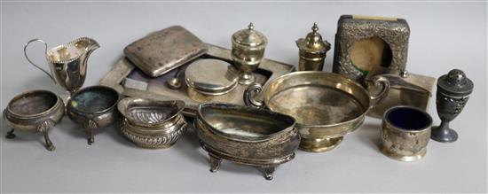 A small group of assorted silver items, including a photograph frame, condiments, cream jug and cigarette case.